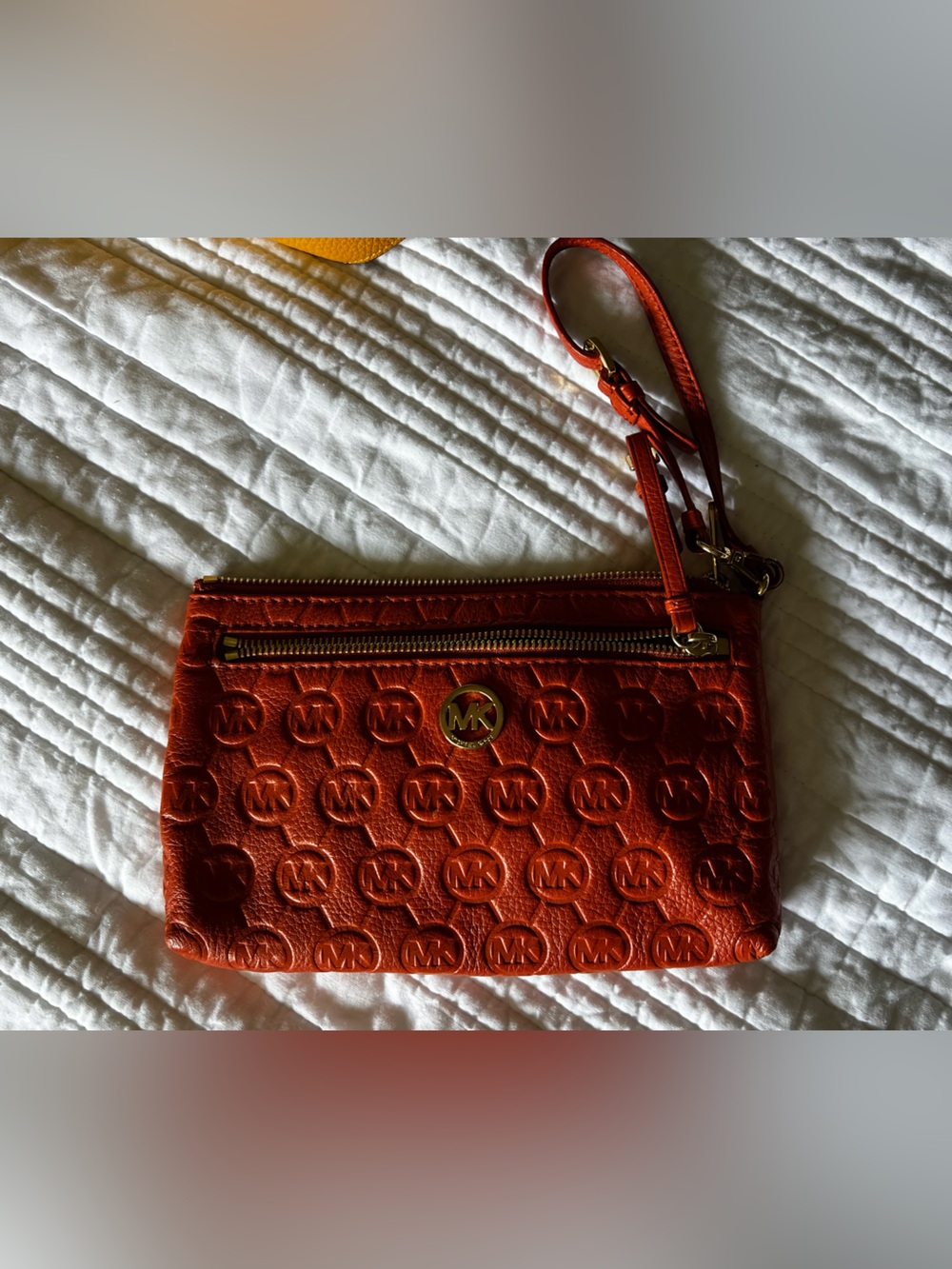 Michael Kors Orange Embossed Logo Wristlet Clutch with Gold Hardware